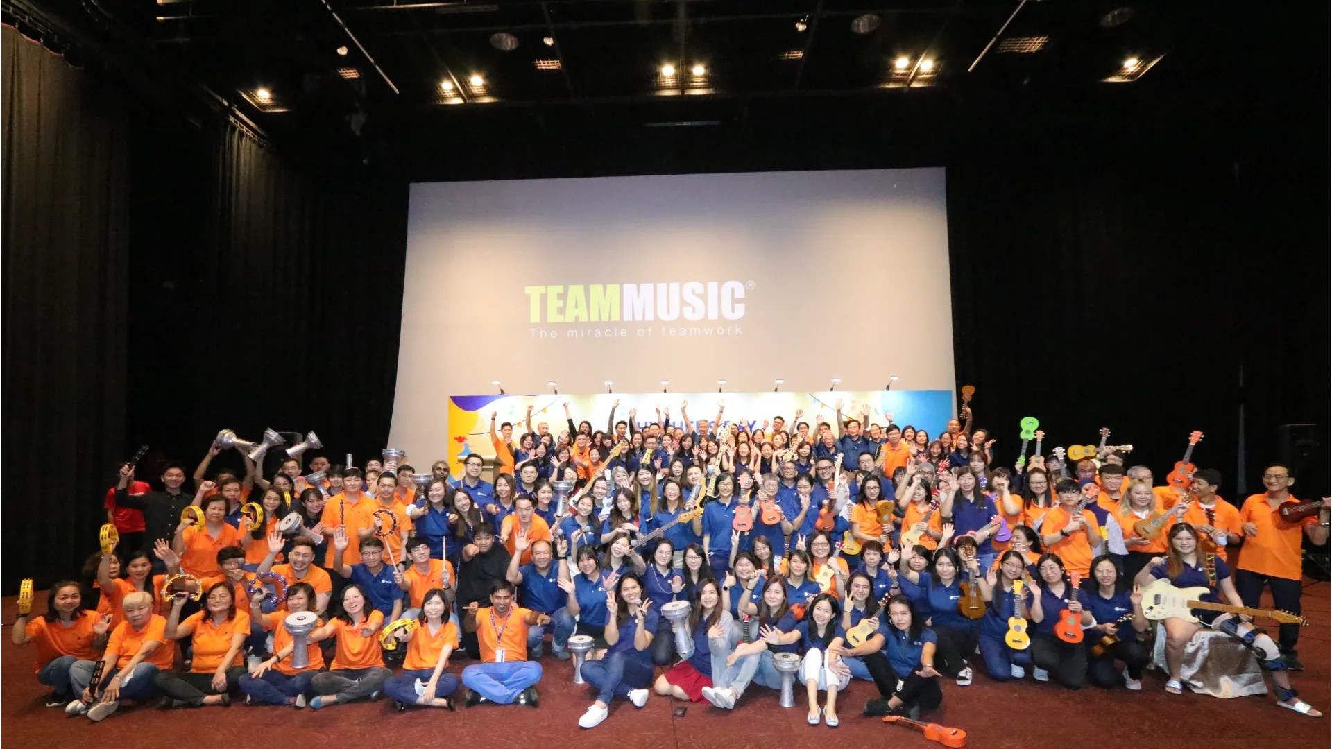 BANDINC — a ~150 pax group on stage as one big rock band