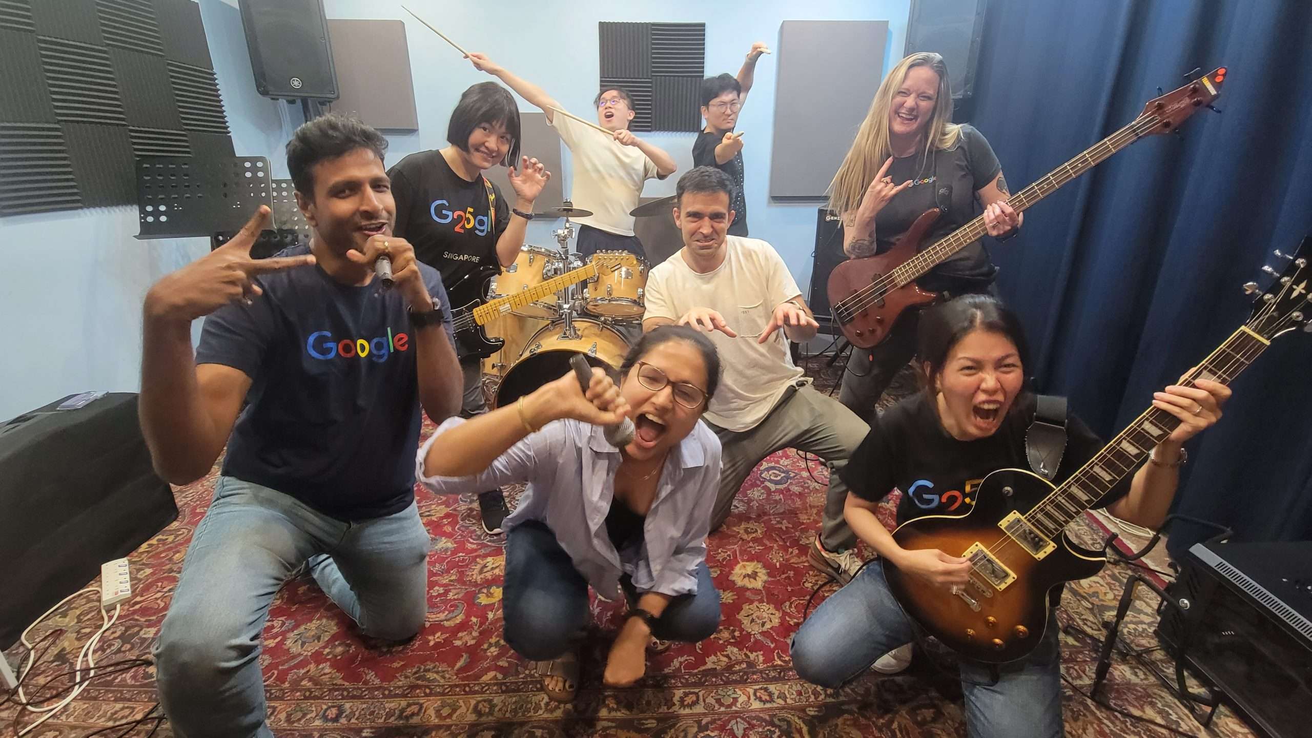 A corporate team rocking out as a band in the studio