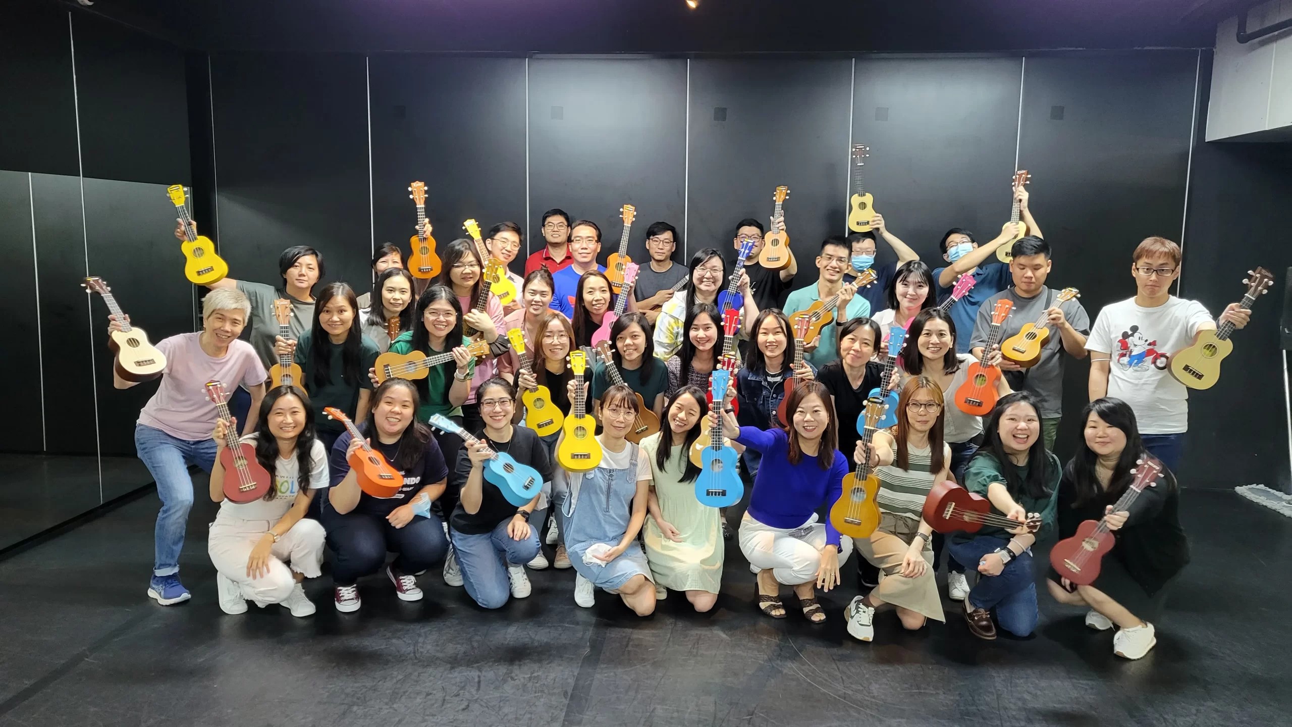UKULELEINC group with colourful ukuleles
